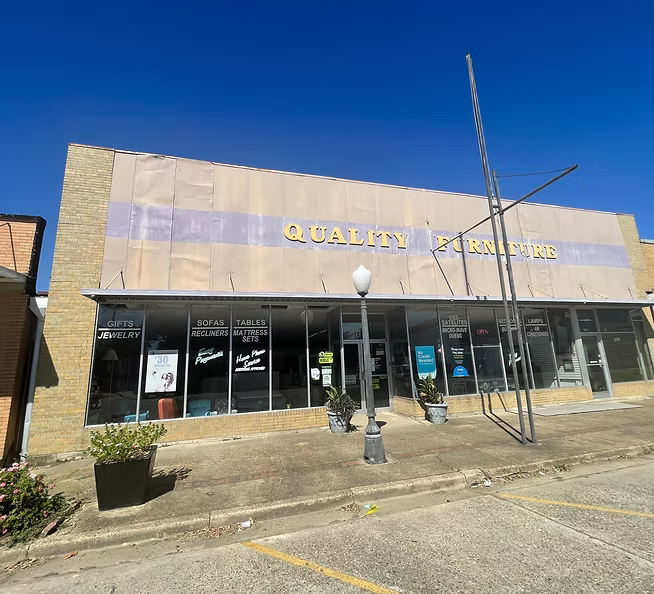 209 Louisiana Avenue — original Quality Furniture façade before revitalization